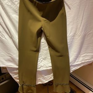 Prada pants with slightly flared bottom-side zipper piping detail around waist
